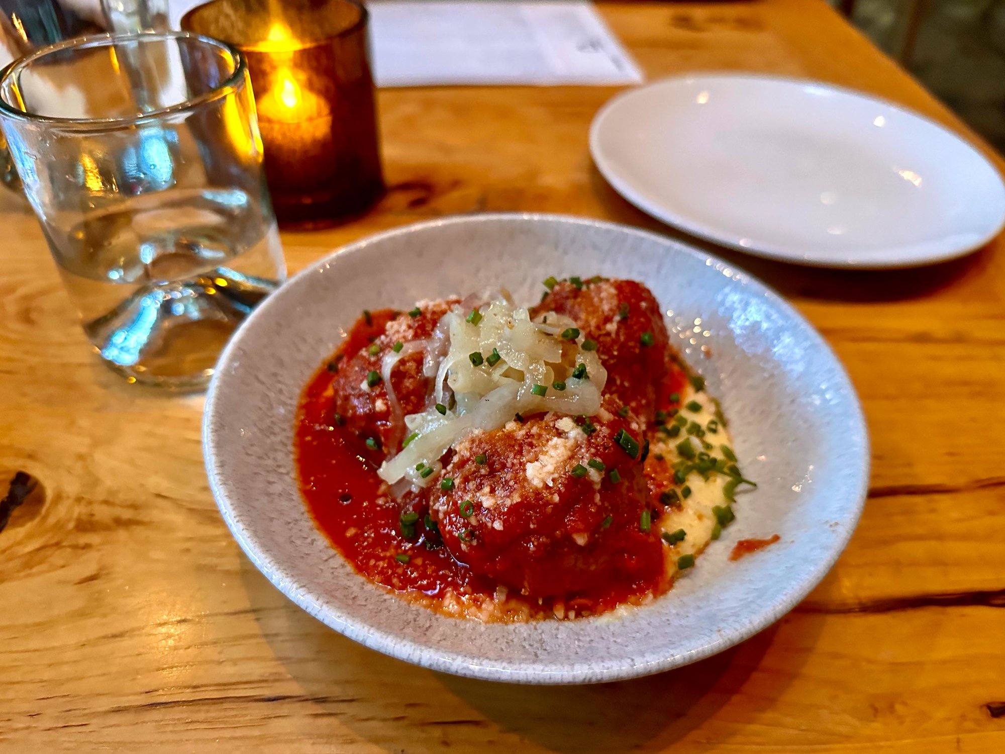 Bowl of giant meatballs in sauce